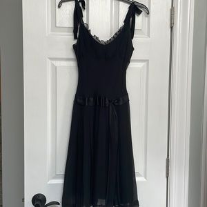 Little black dress with straps that tie to adjust length